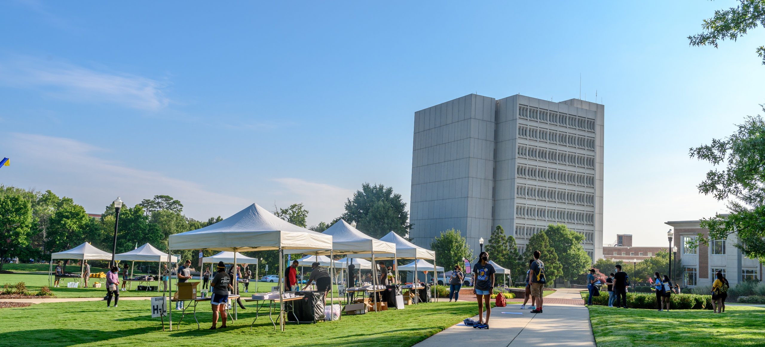 outdoor shot of the EUC lawn with tents during SOAR, Jackson Library in background